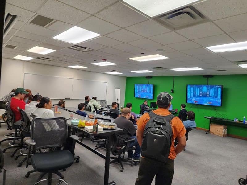 Students playing a video game in the Flex Room