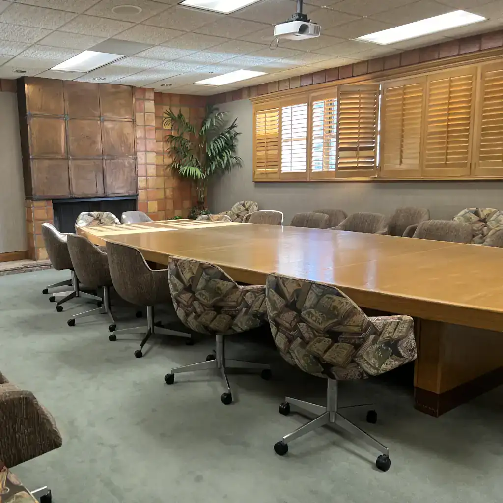 A photo of the inside of the Fireplace Room, one of several conference or meeting spaces set up for public use.